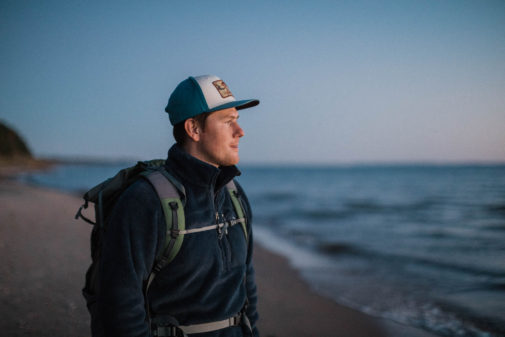Producer Ryan Borts hiking Lake Superior