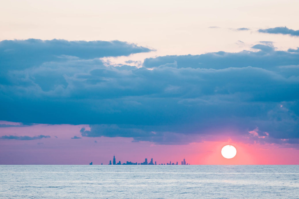 Chicago skyline over Lake Michigan at sunset