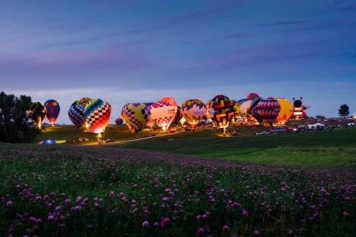 Tourism Example - Altoona Iowa's National Balloon Classic night glow with hot air balloons.