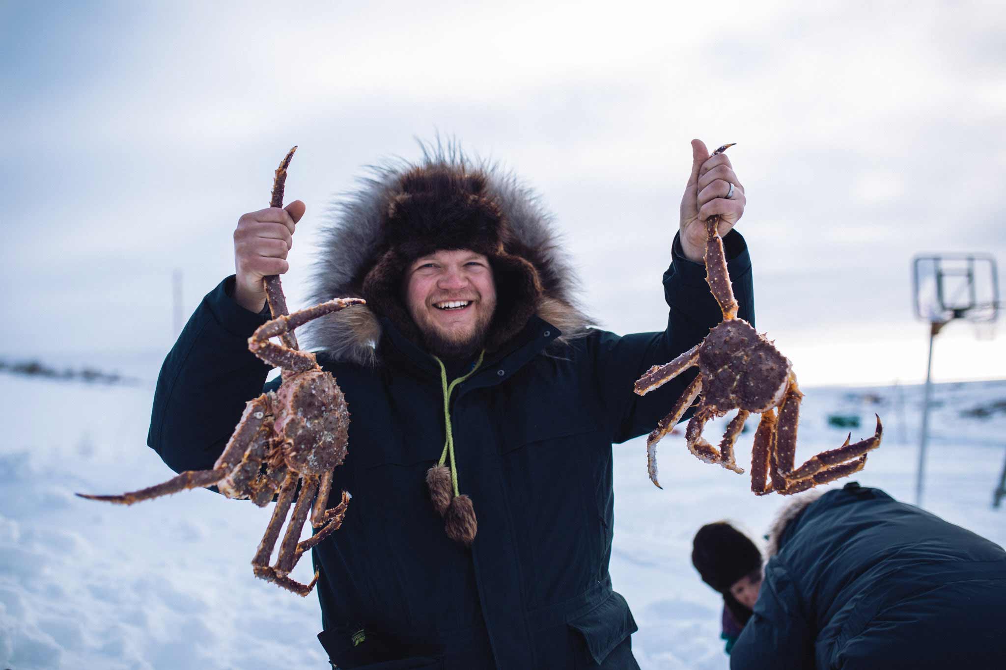 dave showing off king crabs in Nome