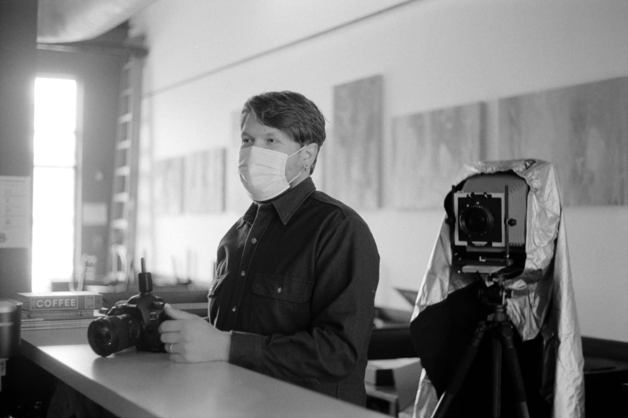 Photographer Dave Poyzer next to 8x10 large format camera