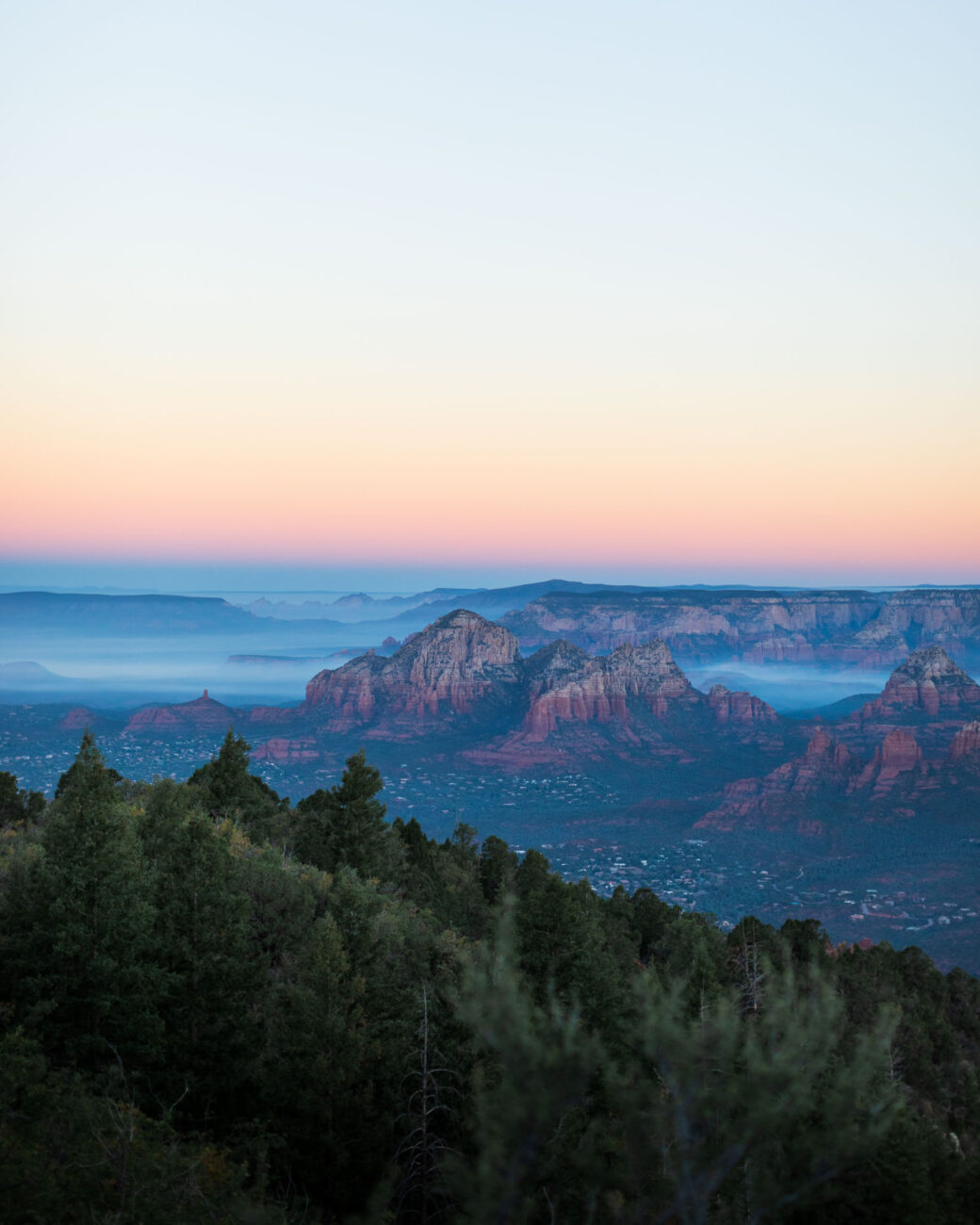 Capitol Butte in the Sedona Valley at sunrise with fog. Sedona, Arizona.